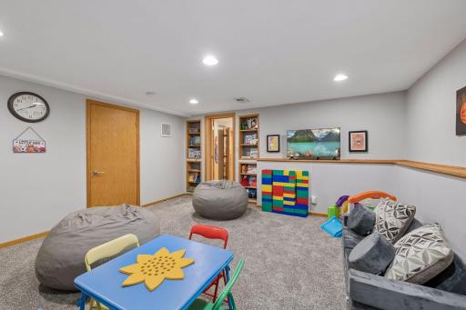 Designed for everyday living and fun, this expansive lower-level family room offers ample space for kids to play while still providing room to relax and unwind.