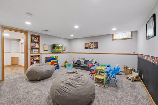 A large lower-level recreation room provides endless possibilities for a playroom, media space, game room, or flexible living area to fit your lifestyle.