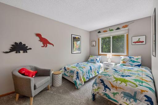 Designed with flexibility in mind, the upper-level secondary bedrooms offer spacious layouts, peaceful views, and abundant natural light.