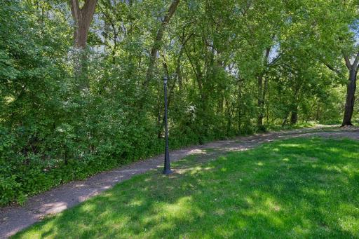 A standout feature of this home is its premium location backing to mature woods and open green space, offering privacy, tranquility, and scenic views rarely available in a townhome community.
