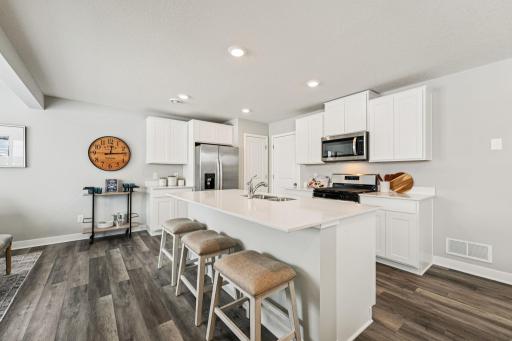 Another view of the Kitchen. Photo of model home, color & options will vary.