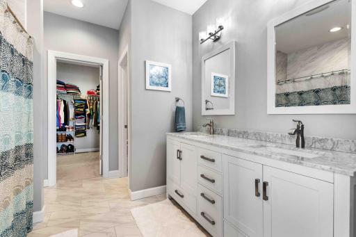 En suite with dual quartz vanities!