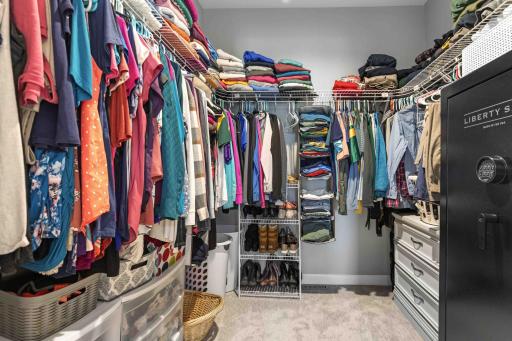 Primary bedroom walk-in closet