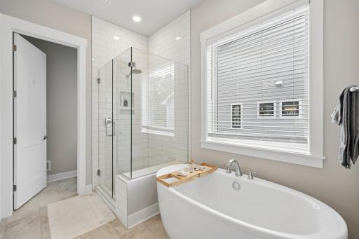 Indulge in the spa-inspired primary bath, highlighted by a soaking tub and a beautifully designed walk-in shower.