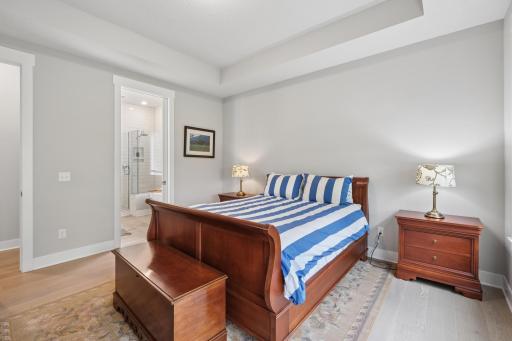 Whether enjoyed as a quiet retreat or a functional everyday space, this view captures the essence of the primary bedroom as a refined, comfortable sanctuary.