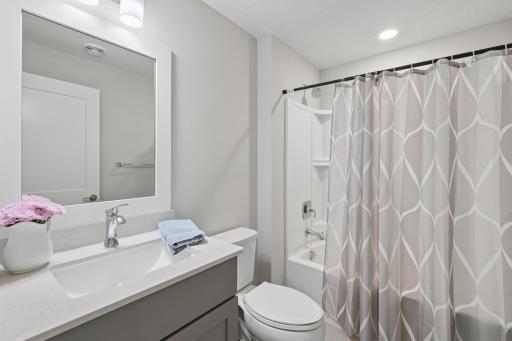 Conveniently located within the lower level, this bathroom enhances the overall livability of the space, providing easy access for nearby bedroom and living areas while ensuring comfort and privacy for family and guests alike.