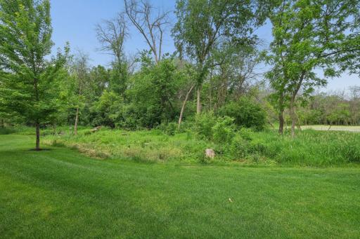 The screened in porch overlooks a peaceful, wooded backyard, this serene outdoor space offers a quiet connection to natureâEnjoy relaxing, entertaining, or simply unwinding in a tranquil setting.