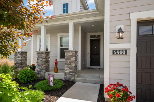 A welcoming front porch in the Minnetonka Country Club neighborhood. The whole area has that warm, woodsy, charm that makes porches feel like an extension of the outdoors.