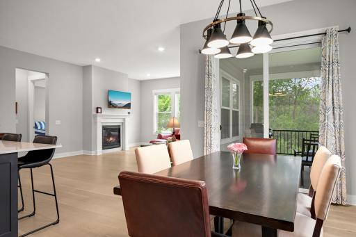 The dining room is ideally situated adjacent to the screened porch, creating a seamless connection between indoor and outdoor. Enjoy a quiet dinner or invite friends and family to join.