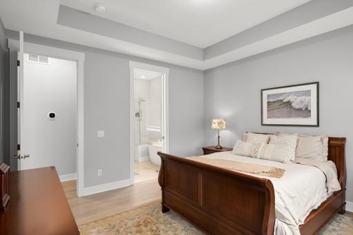 Whether enjoyed as a quiet retreat or a functional everyday space, this view captures the essence of the primary bedroom as a refined, comfortable sanctuary.