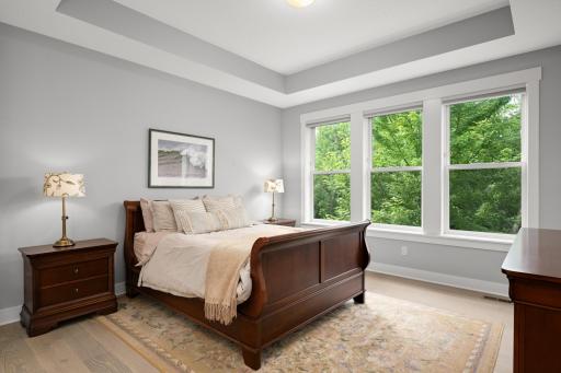 The primary bedroom is a refined sanctuary where relaxation takes center stage. Natural light enhances the rooms open airy fee. Inviting slow mornings and restful nights.