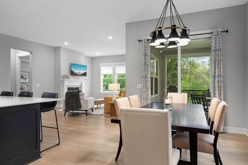 The dining room is ideally situated adjacent to the screened porch, creating a seamless connection between indoor and outdoor. Enjoy a quiet dinner or invite friends and family to join.