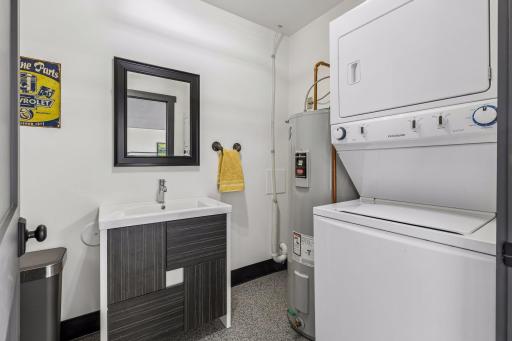 Garage level 1/2 bath with washer and dryer