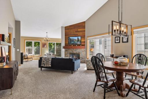Open-concept layout offers spacious living and dining areas plus a large sunroom off the back