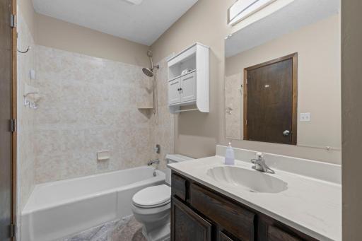 Main Floor Full Bath With Walkthrough To Primary Bedroom