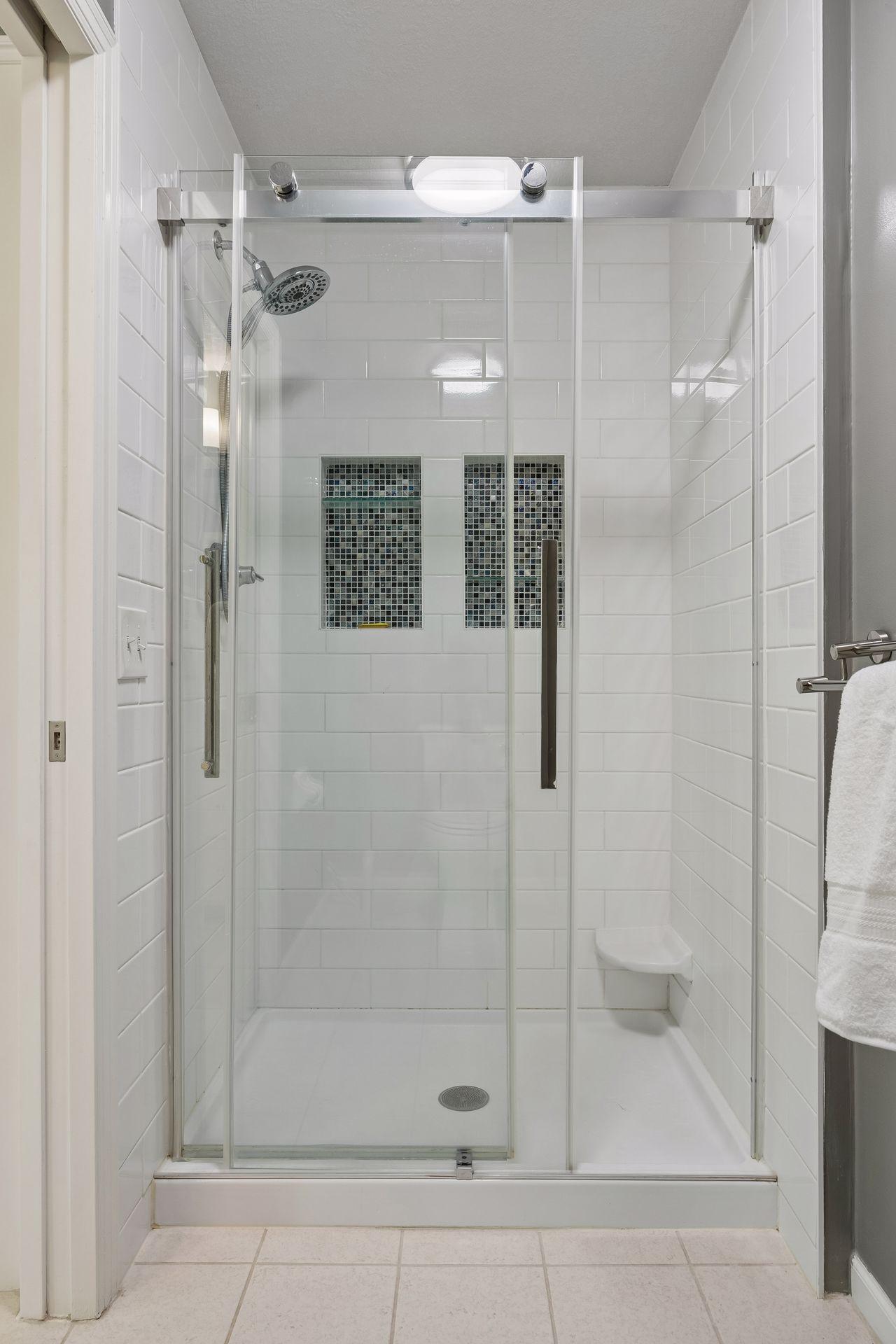 Beautifully updated primary shower with a clean, modern finish and spacious design.