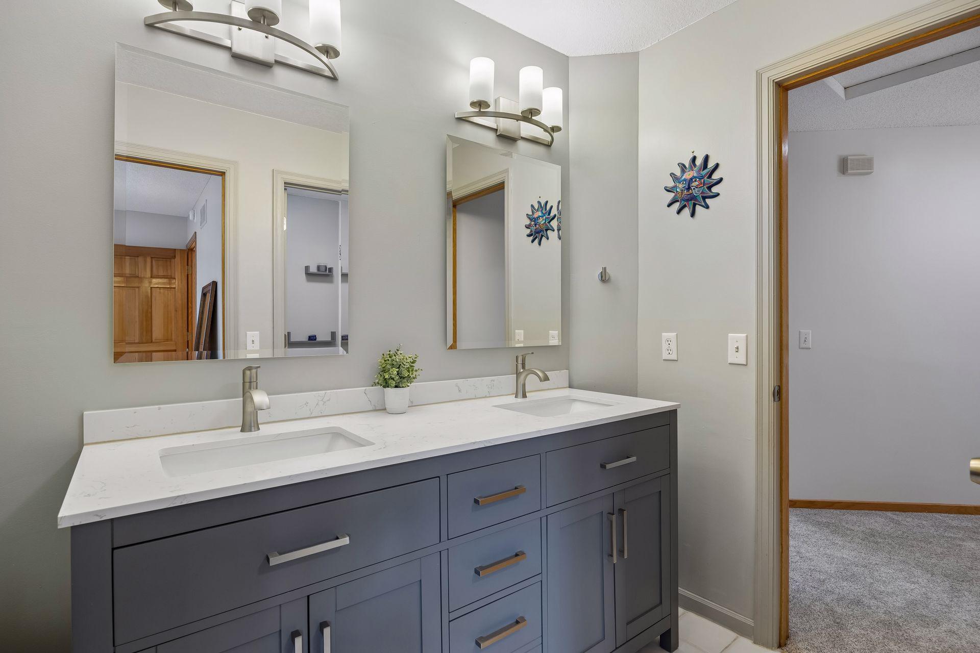 Conveniently located bathroom with access from the hallway and direct access to one of the upper-level bedrooms.