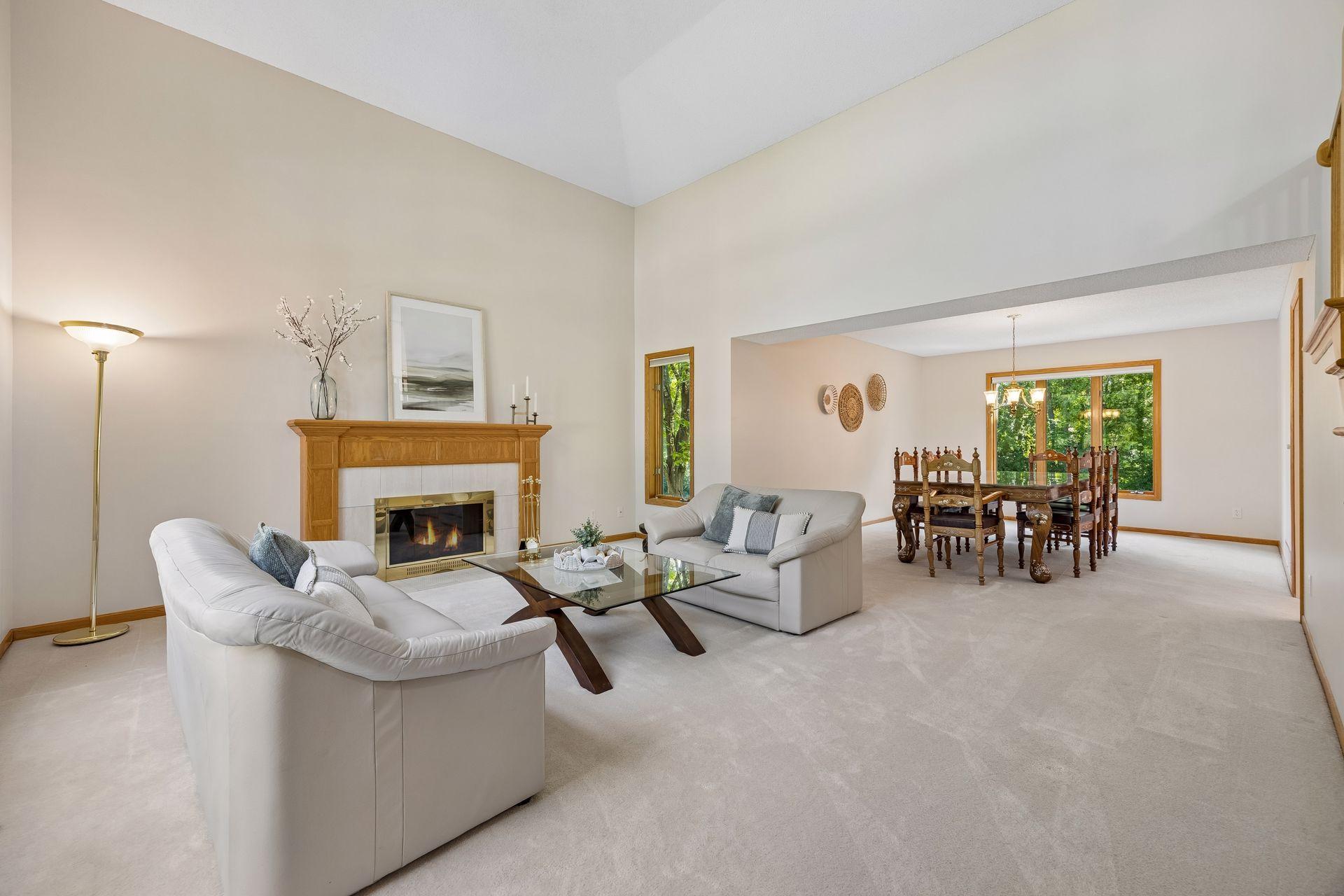 Spacious living and dining areas designed for comfortable living and entertaining, with soaring two-story ceilings in the living room creating an impressive sense of space.