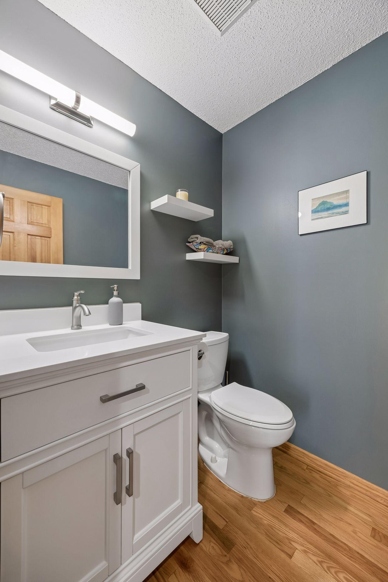 Conveniently located and updated main floor powder room, perfect for guests and everyday living.