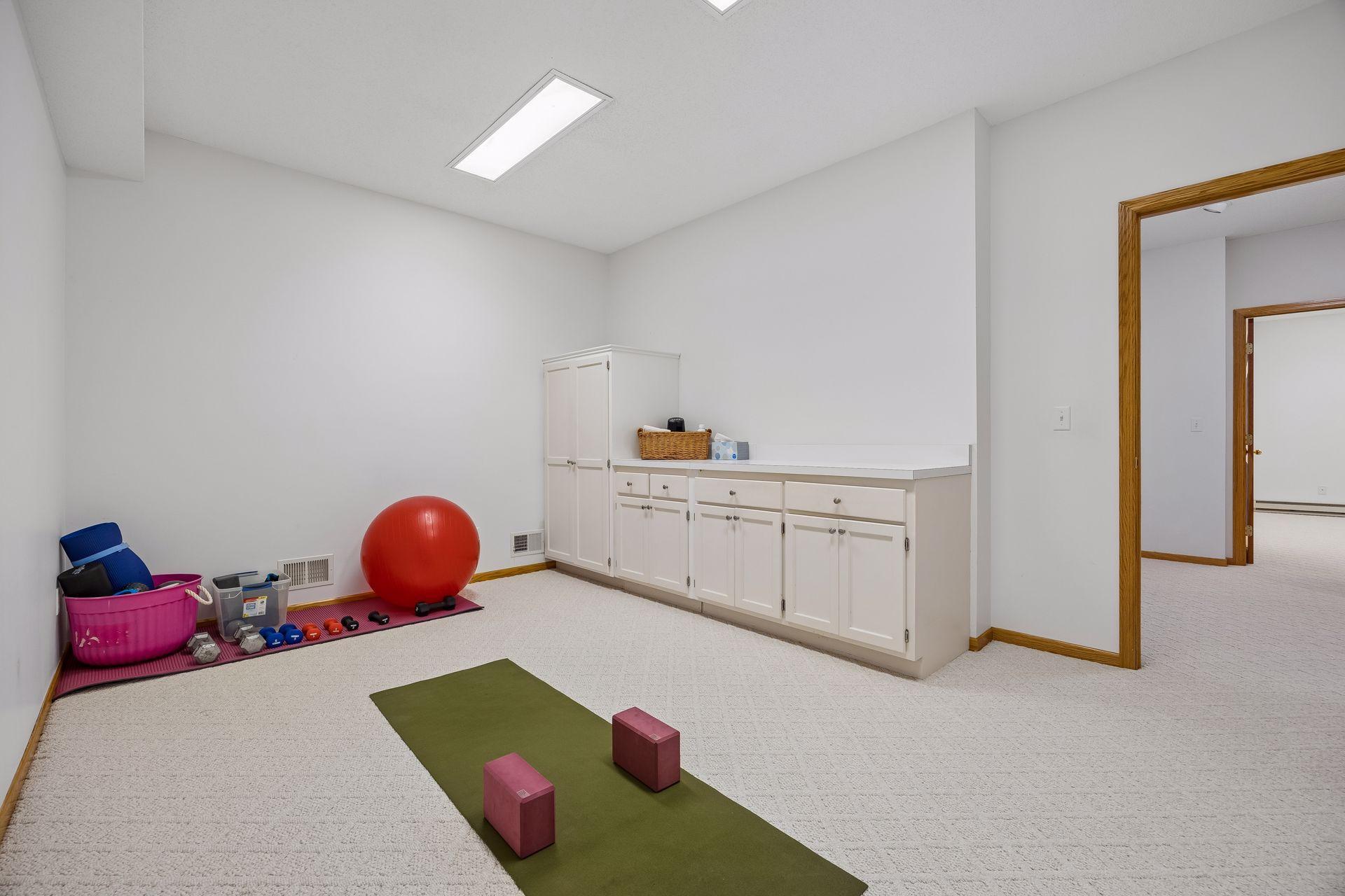 Additional lower-level flex space offers versatility for a workout area, home office, craft room, or whatever best fits your needs.