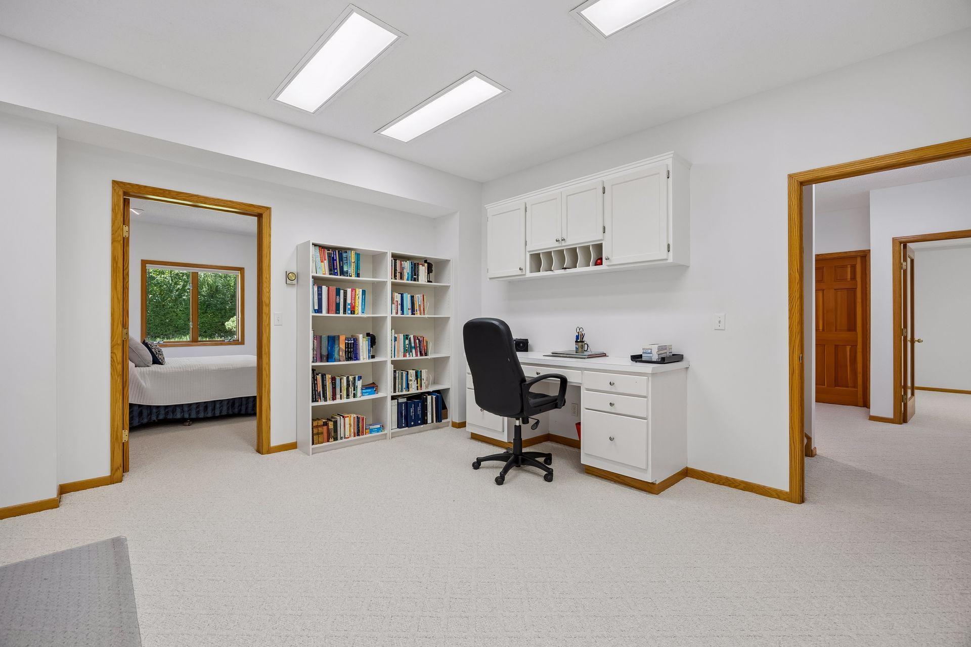 Spacious lower-level flex space offering endless possibilities for a home office, exercise room, hobby space, or additional living area.