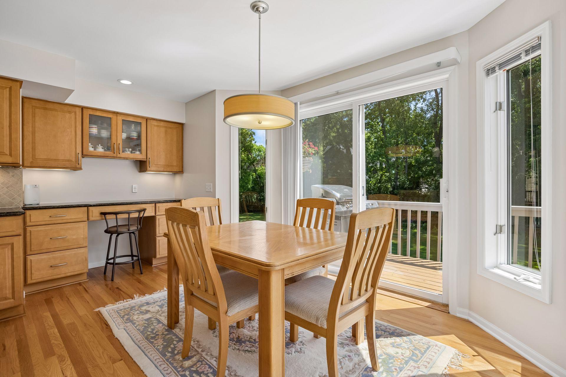 Bright eat-in kitchen with peaceful views of the private backyard, creating a welcoming space for everyday meals and casual gatherings.
