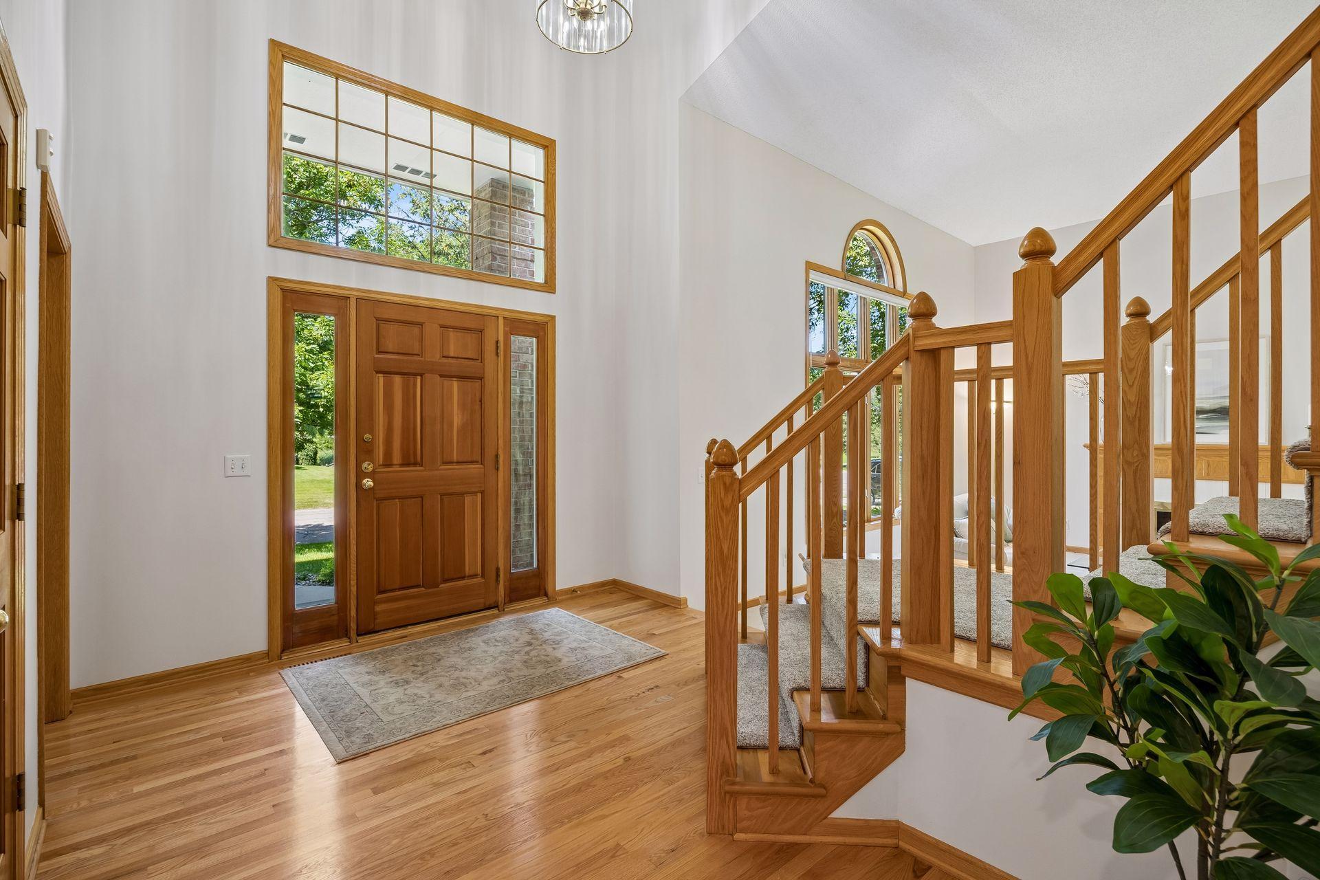 Welcoming grand entry with soaring ceilings and an open floor plan that creates an airy, spacious feel.