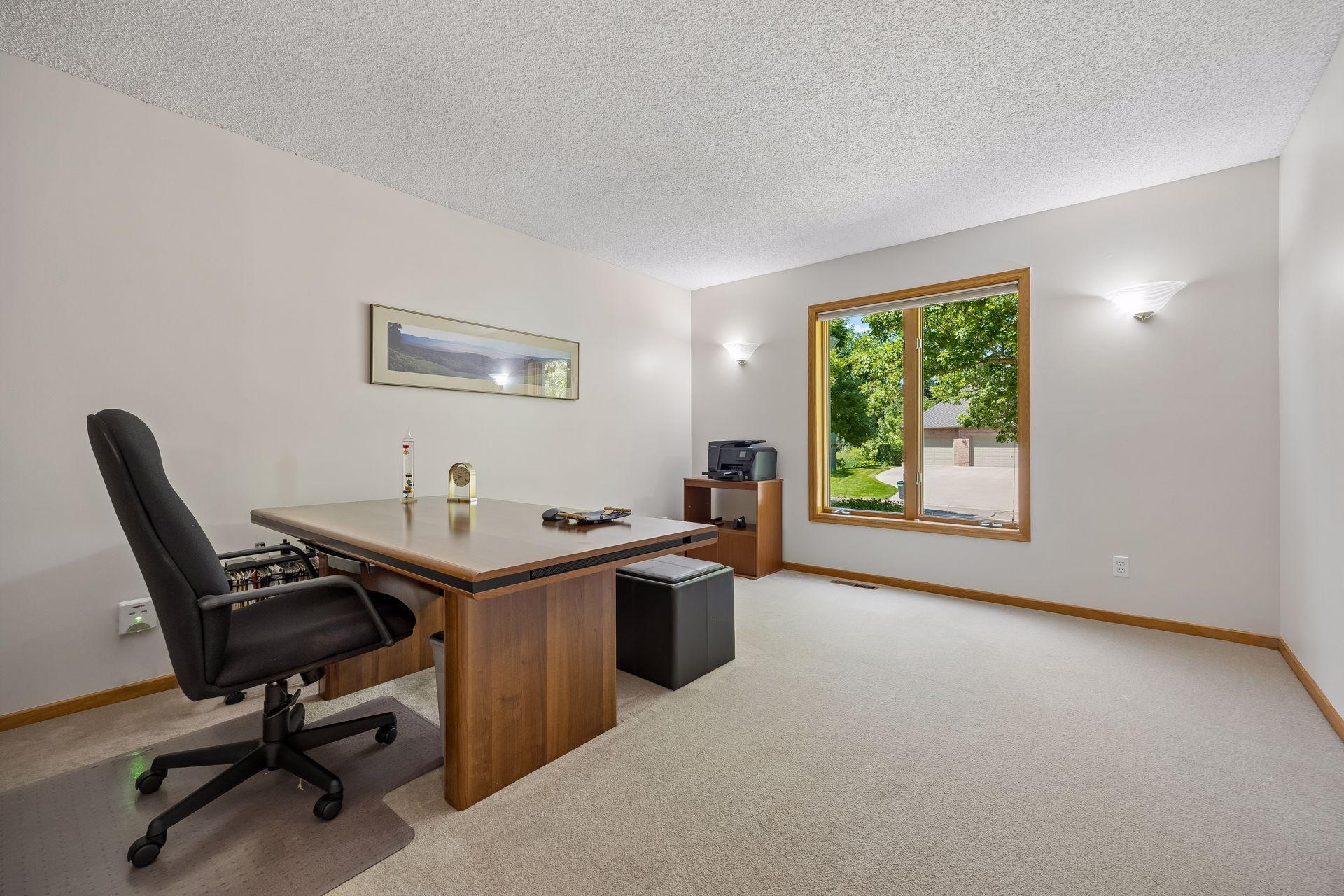 Bright and versatile main floor office, ideal for working from home, a study, or flexible living space.