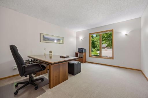 Bright and versatile main floor office, ideal for working from home, a study, or flexible living space.