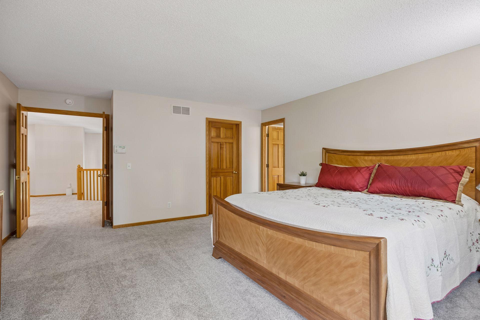 Inviting primary bedroom featuring a generous walk-in closet and plenty of room to create a comfortable private retreat.