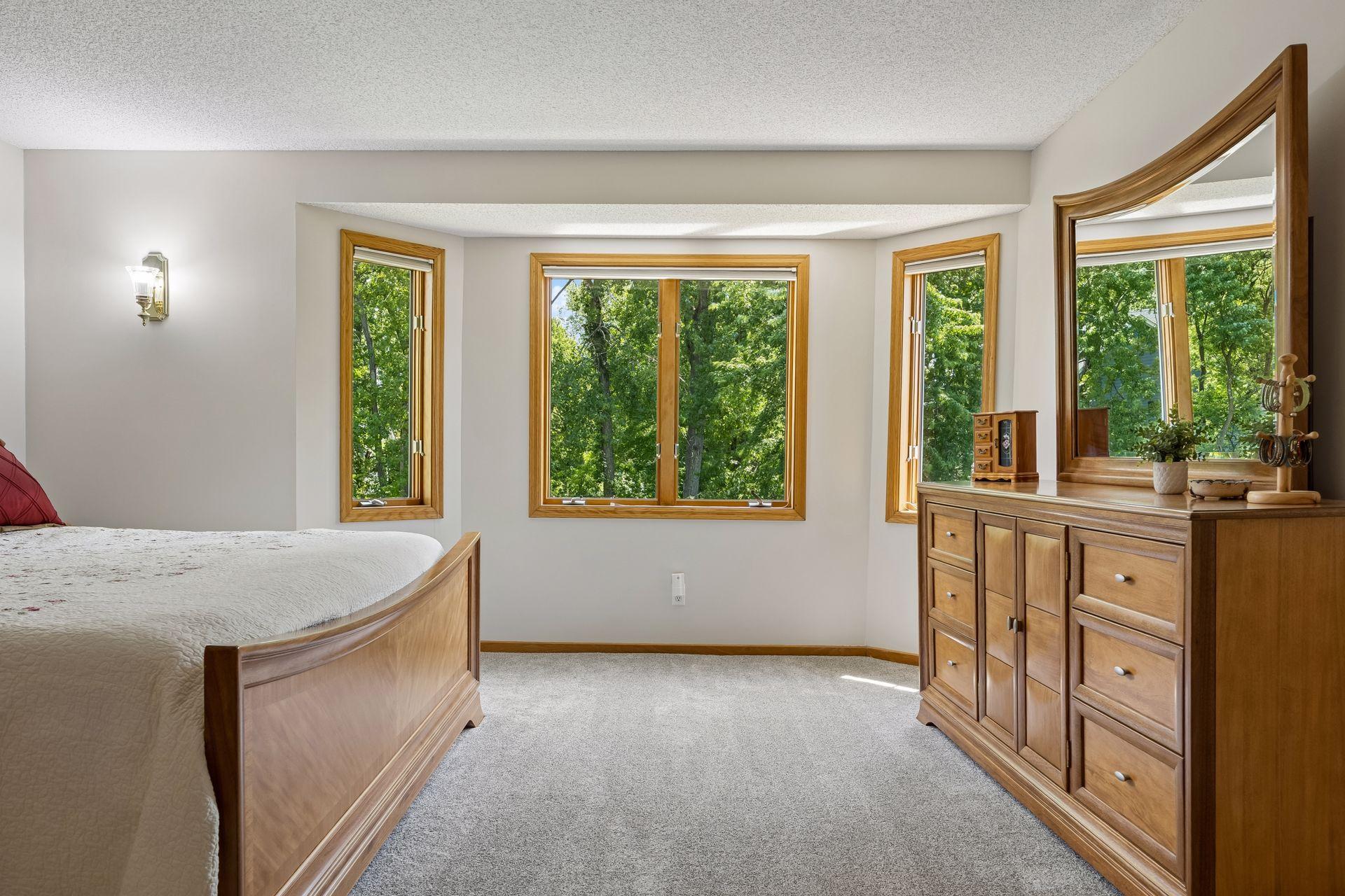 Inviting primary bedroom featuring a generous walk-in closet and plenty of room to create a comfortable private retreat.