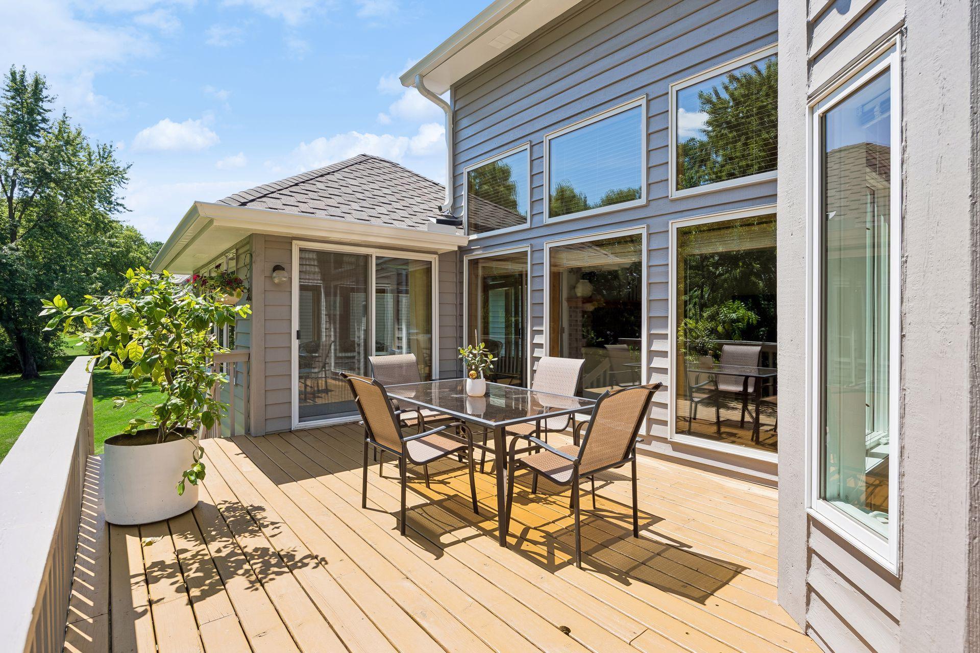 Spacious deck off the back of the home creates a private retreat overlooking the backyard—perfect for relaxing, entertaining, and enjoying the peaceful outdoor setting.
