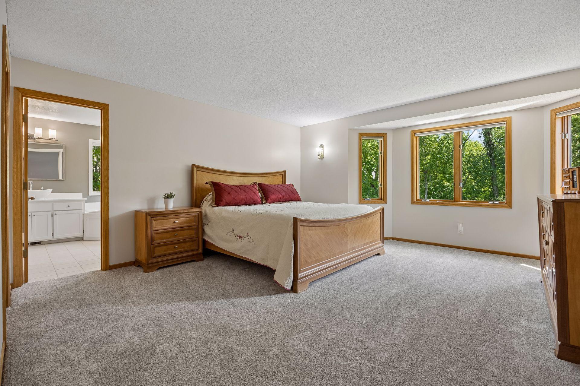 Inviting primary bedroom featuring a generous walk-in closet and plenty of room to create a comfortable private retreat.