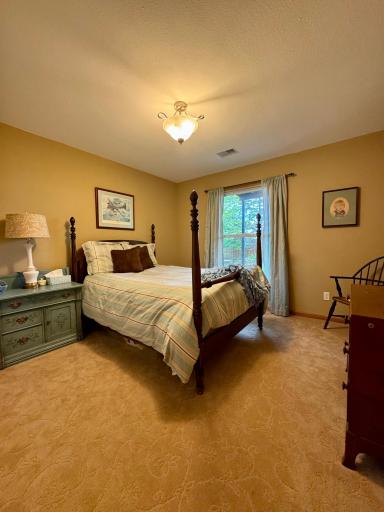 The 2nd bedroom is bright and spacious and also has nature views of the private back yard.