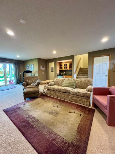 The lower level walkout makes this great room feel warm and inviting.