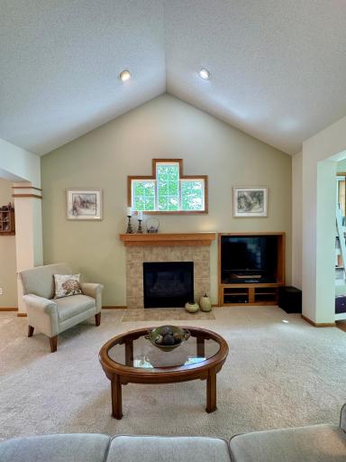 The vaulted ceiling and gas fireplace add charm and character to the living room.