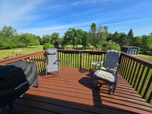 Extending just off the dining room, the lovely deck offers an elevated outdoor experience with views of the backyard and surrounding landscaping.