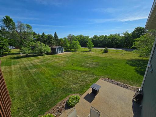 Views of the lower level patio and backyard as seen from the deck.