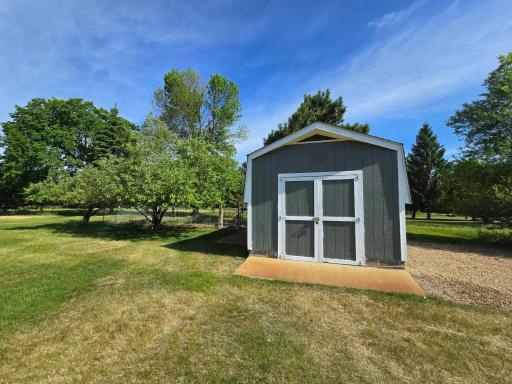 The 18' x 12' storage shed sits on the back corner of the lot and provides 216 square feet of space for all your lawncare needs.