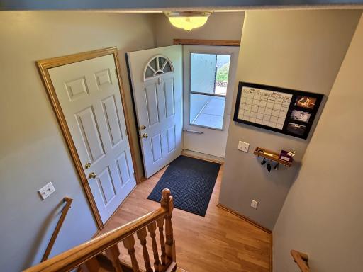 Welcome! The front entrance offers a practical transition from the outdoors in with the laminate floors and nice lighting.