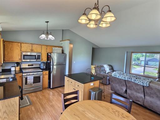 Stainless steel appliances and beautiful granite counters emphasize the already wonderful kitchen space.