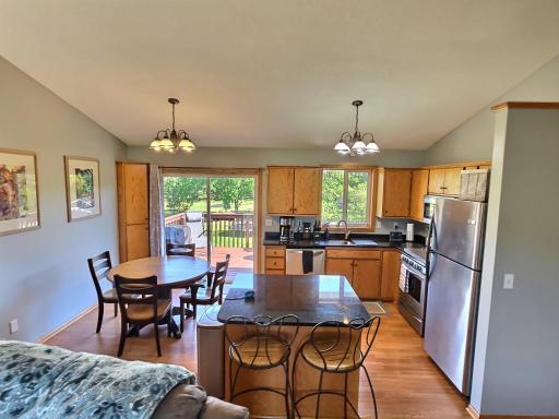 One of the best seats in the house as the granite island, breakfast bar offers views of the deck and lovely backyard.