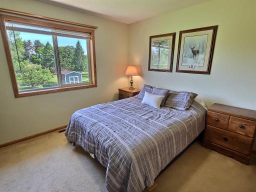 The second bedroom on the upper level provides wonderful views of the backyard, carpet floors, great space.