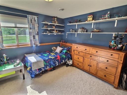 The third bedroom is situated in the lower level and includes carpet floors, day/lookout windows, and a nice sized closet.