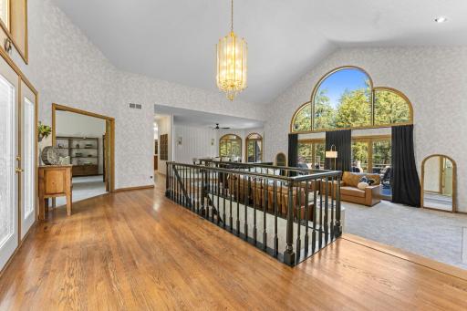 This stunning wall of windows grounds you in the foyer, pulling you to nature from every room.