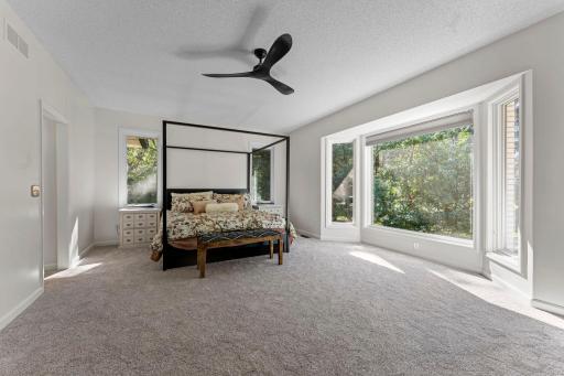 The primary bedroom right on the main level features a huge window for incredible wildlife views.