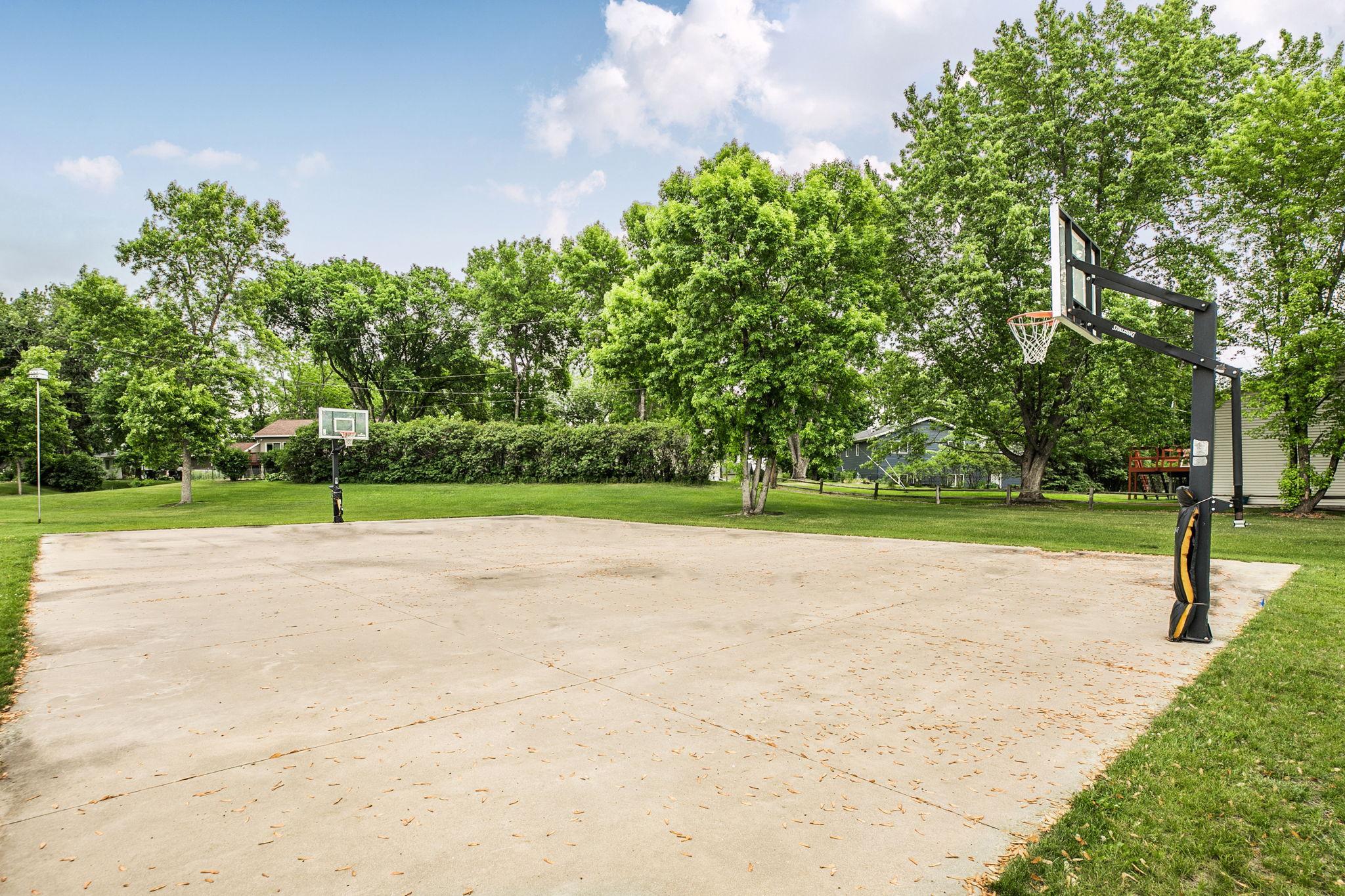 Basketball court nearby provides fun and recreation for everyone to enjoy.