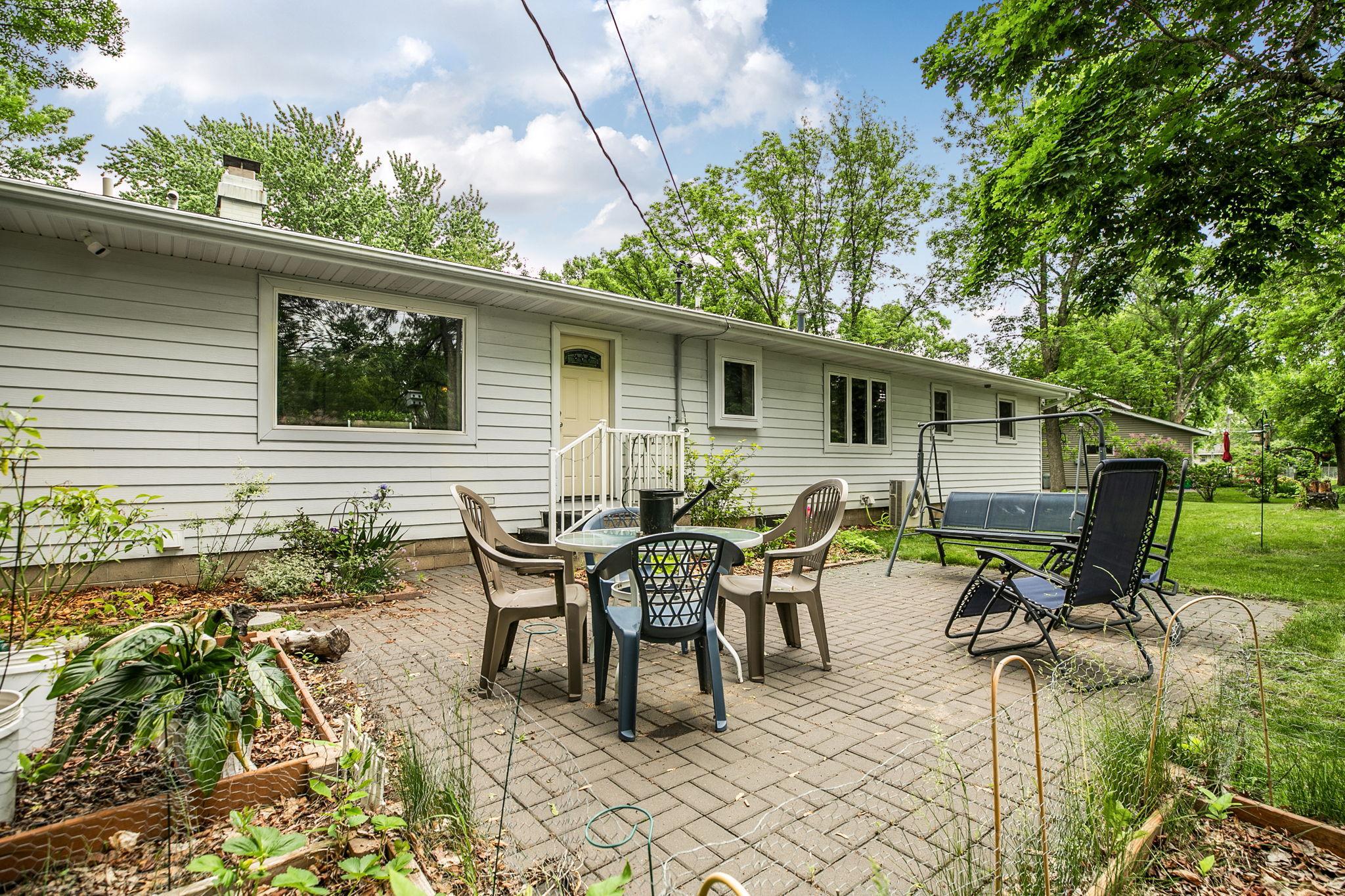 Back patio creates an outdoor living space.