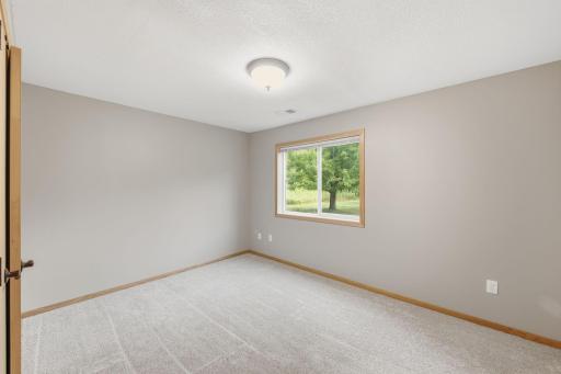 Wake up to backyard views from this basement bedroom