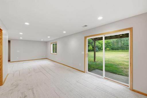 Freshly finished basement with views to the gorgeous backyard-level family room